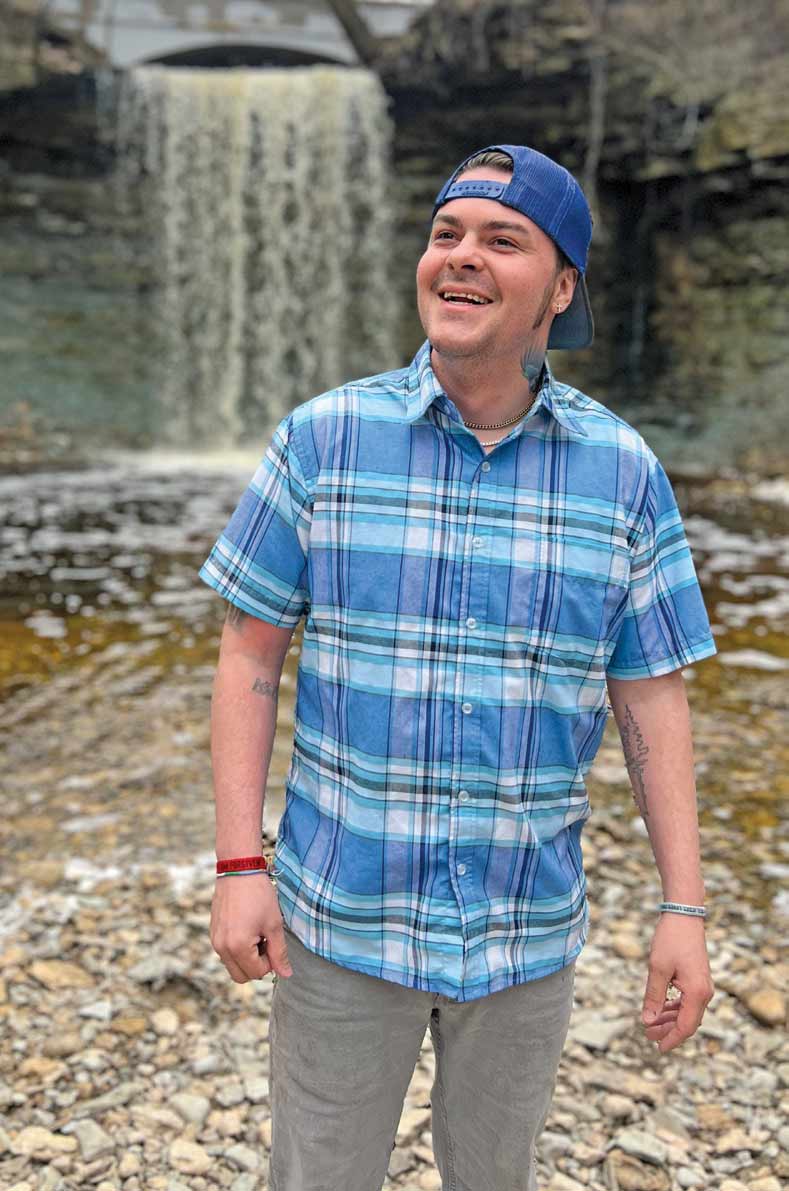 coloe-waterfall Cole standing in front of a waterfall