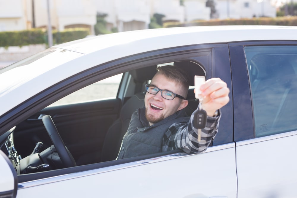 Young,Man,Hold,Key,In,White,Car Young,Man,Hold,Key,In,White,Car