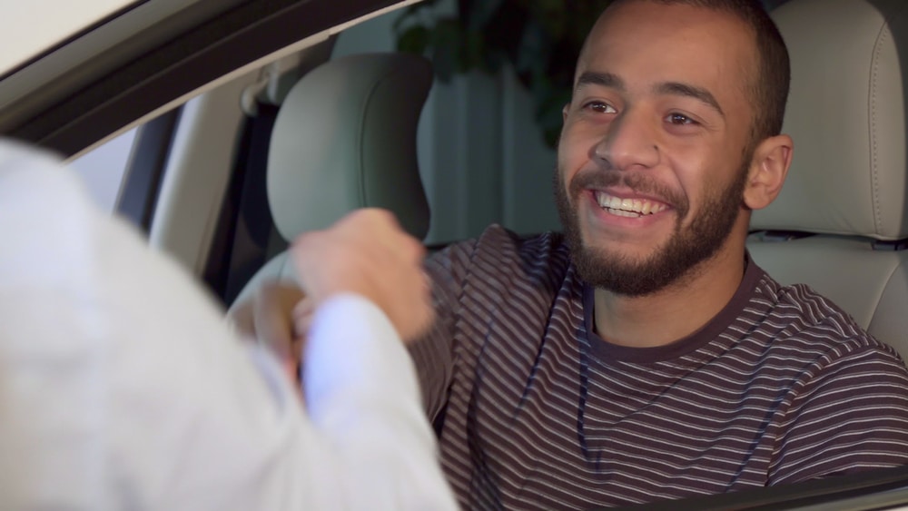 Handsome,African,American,Man,Getting,Car,Key,At,The,Dealeship.