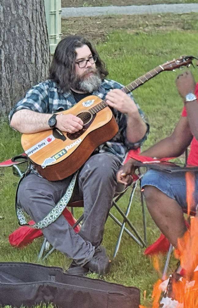 Mathew playing guitar