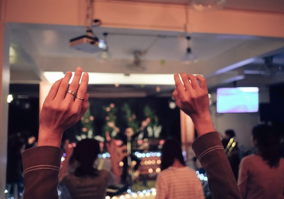 Women,Raise,Their,Hands,To,Worship,God.